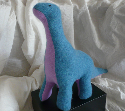 Tall blue and pink stuffed dinosaur